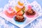 Assorted cup cakes with angel, heart, tangerine, strawberry