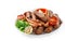 Assorted delicious grilled meat and sausages with tomatoes and bbq sauce on white plate isolated on blue background.