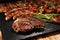 Assorted delicious grilled meat with vegetable on a barbecue with steak