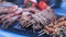 Assorted delicious seafood delicacies cooked at the street food festival for sale including shrimp, octopus mussels and