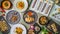 assorted dishes of Chinese and Japan cuisine top view on table