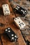 Assorted dominoes on rustic wooden background