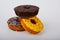 Assorted donuts with chocolate frosted, yellow glazed and sprinkles donuts