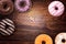 Assorted donuts on wooden background