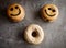 Assorted doughnuts on grey tablecloth