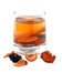 Assorted dried fruit compote in a glass on a white background.