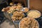 Assorted dried fruits in baskets in bazaar market