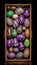 Assorted Easter eggs in a decorative frame - colorful spring holiday decor. Vertical photo