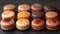 Assorted elegant french macarons displayed on dark background. perfect for culinary websites and dessert recipes