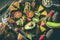 Assorted fruits on a plate. Avocados, blood oranges, kiwis, pineapple and strawberries