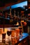 Assorted glasses of beer on drip tray with bartender pouring fresh pint of dark beer from tap. Serving craft beer from