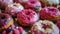 Assorted Gourmet Donuts on a Wooden Table