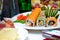 Assorted gourmet sushi rolls on a buffet