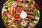 Assorted grilled meat and vegetables on rustic table