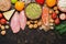 Assorted healthy food on a dark background. Vegetables, fruits, fish, chicken, dairy products, eggs, nuts. Top view, space for you