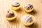 Assorted homemade chocolate truffles. Selective focus. Rustic wooden table.