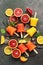 Assorted homemade frozen citrus juice. Popsicles from different oranges with ice and mint leaves. Summer dessert. Top view, flat