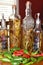 Assorted hot peppers and glass vinegar bottles