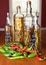 Assorted hot peppers and glass vinegar bottles