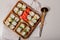Assorted hot rolls with eel, Japanese omelet, cream cheese, fried onions and unagi sauce with fresh herbs. Japanese food on a
