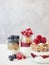 Assorted jars with berries and granola