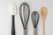 Assorted Kitchen Utensils on White Background Cropped Close Top