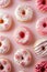Assorted lavender and pink frosted donuts on a white background. Ideal for confectionery. AI Generated