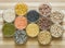 Assorted lentils and legumes in glass bowls, on a chopping board