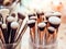 Assorted makeup brushes with copy space, beauty artist workspace, bunch of different brushes on blurred background