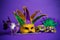 Assorted Mardi Gras or Carnivale mask on a purple background