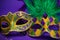 Assorted Mardi Gras or Carnivale masks on purple
