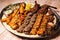 Assorted mix grills with chicken tikka, beef kabab, mutton kebab, wings, boti, malai, chop, shish tawook served in dish isolated