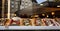 Assorted mouth-watering Belgian waffles in a shop window. Panorama format