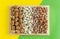 Assorted nuts banner background: hazelnuts walnuts, brazilian nuts, pecans, almonds, cashews. Flatlay organic mixed nuts banner.