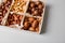 Assorted nuts in a wooden box nuts: pecan, almond, macadamia, brazil, cashew