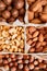 Assorted nuts in a wooden box nuts: pecan, almond, macadamia, brazil, cashew