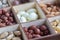 Assorted nuts in a wooden box. Set of almonds, peanuts, cashews, pistachios, macadamia, hazelnuts