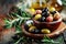 Assorted Olives in a Clay Bowl With Olive Oil and Rosemary on a Rustic Wooden Table