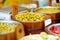 Assorted organic pickled olives, garlic, hot peppers, capers and sundried tomatos sold on a marketplace in Vilnius, Lithuania