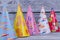 Assorted party hats on wooden background.