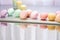 assorted pastel-colored cupcakes on a mirror reflective table