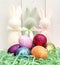 assorted pastel Easter bunnies, sparkly bright colored eggs