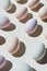 Assorted pastel eggs casting shadows, a playful take on minimalism. Useful for creative design and art direction. - AI Generated