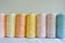 Assorted Pastel Yarn Spools for Crafting and Knitting.