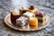 assorted petit fours on a stylish marble tray