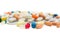 Assorted pharmaceutical medicine pills, tablets and capsules over white background