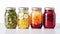 Assorted pickled or fermented vegetables in jars on white, sealed and stored