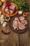 Assorted raw pork meat. Fresh loin, spices, fragrant vegetables and parsley