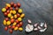 Assorted red, dark, yellow and orange small cherry tomatoes