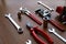 Assorted red tool set, screwdriver, pliers, saw